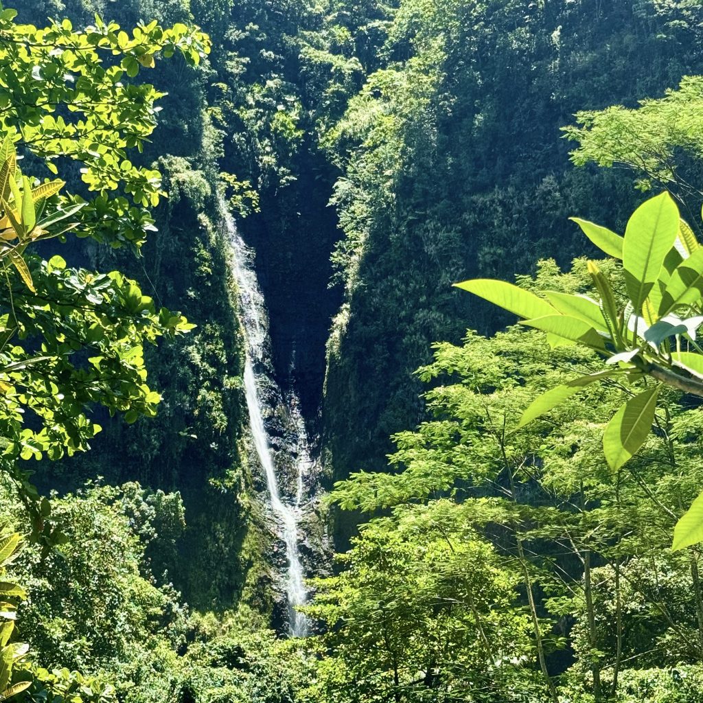 the majestic Vaimahutu Falls hidden in lush rainforest, Tahiti