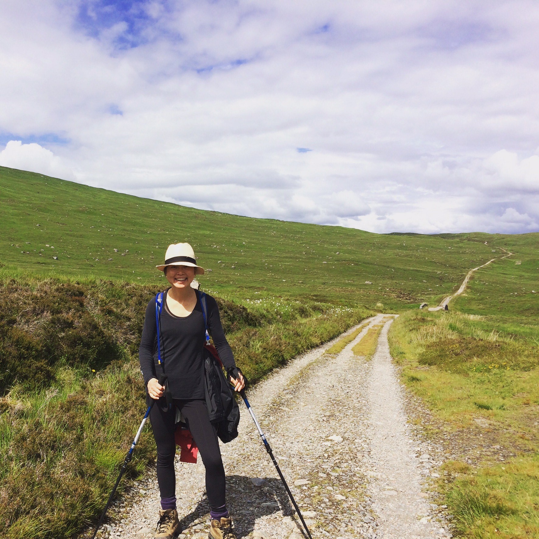 Kathy is standing at the beginning of a long trail in Scotland